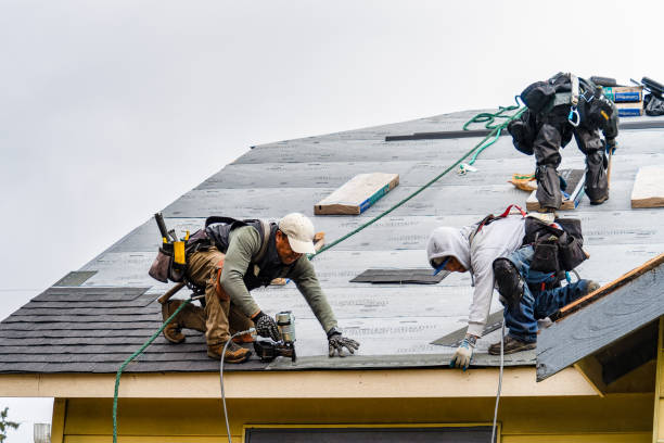 Professional Roofing technician working in Robertsville, NJ